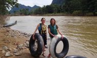 Tubing down a dirty river in Vang Vieng